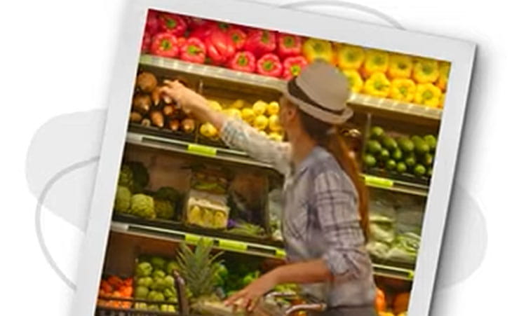 Screen Capture from the What is habit stacking video of a woman produce shopping