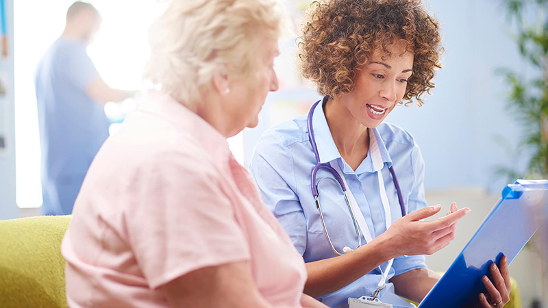 nurse giving instructions to patient