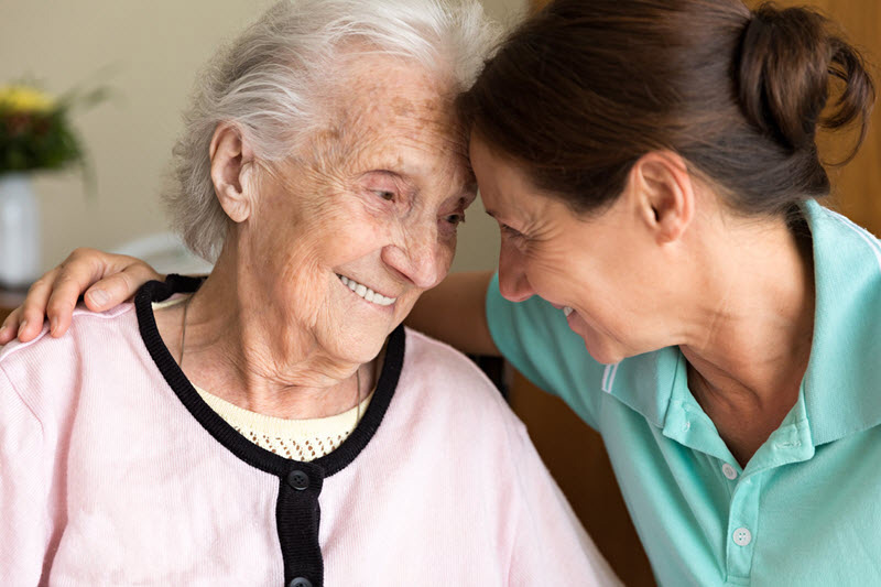 caregiver and elderly woman