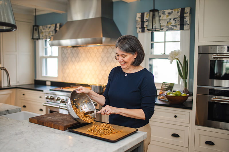 Dr. Jennifer Cluett making granola from a patient’s recipe.