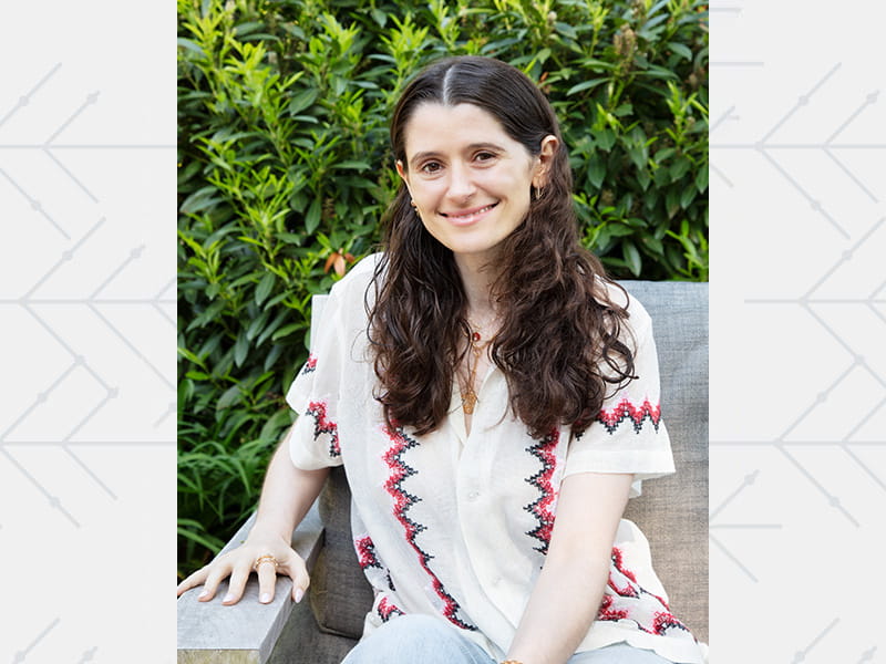 Jennifer Rose Goldman sitting on a sofa outside