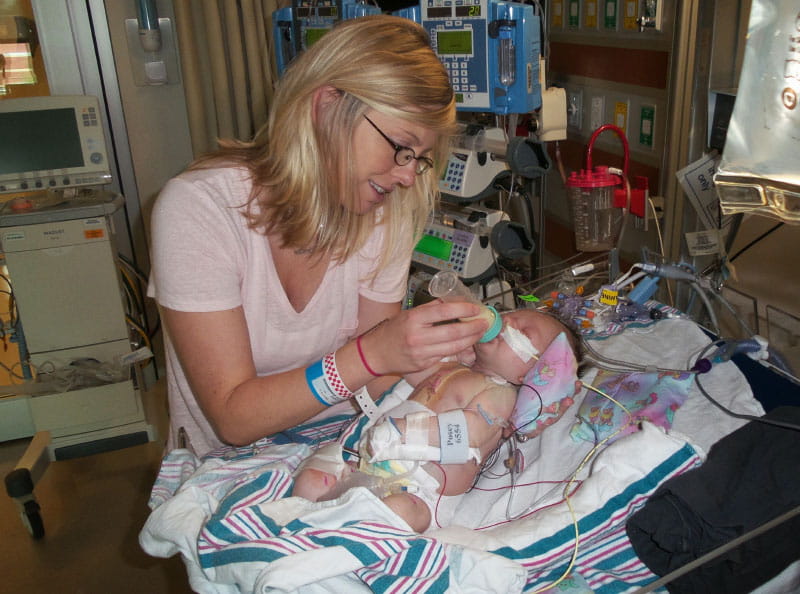 Jamie feeds Jackson as he recovers from one of the two open-heart surgeries he endured within his first three months. (Photo courtesy of the Dawson family)