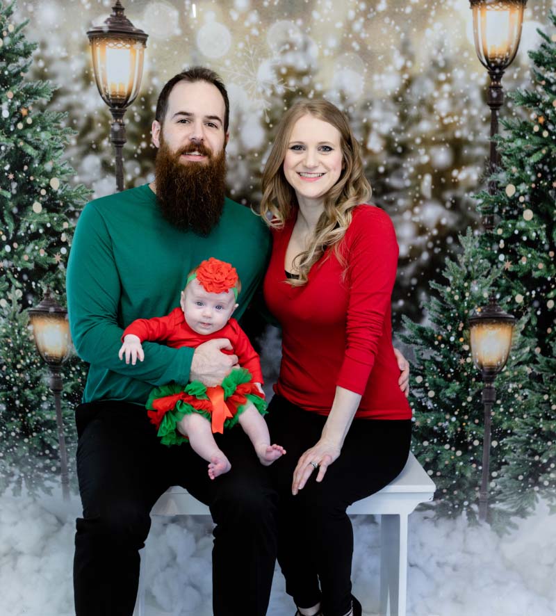 Rob (left) and Brooke Jones holding their daughter, Reese, in 2021. The photo was taken one day before Brooke's cardiac arrest. (Photo courtesy of Rebecca Coe)