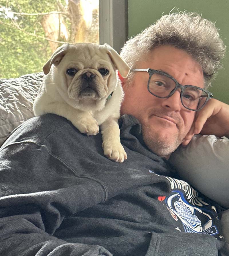 Ed Breech and the family pug, George. (Photo courtesy of the Breech family)