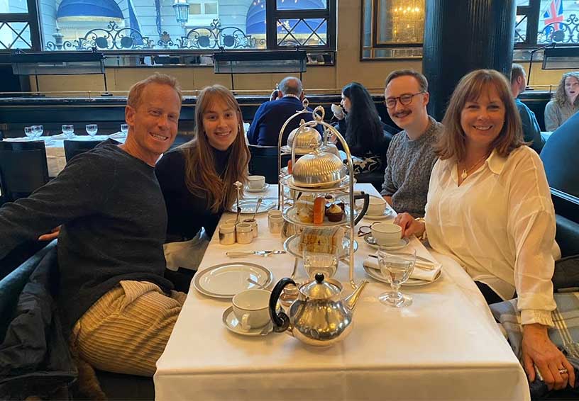 Liv Pines at restaurant table with her parents, Craig and Amy (front), and her brother, Noah 