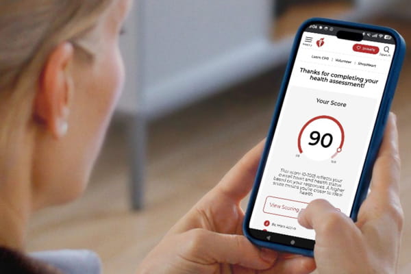 Woman taking the My Life Check® assessment on a mobile device