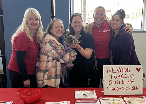 A group of smiling volunteers at a Rural at Heart event in Nevada