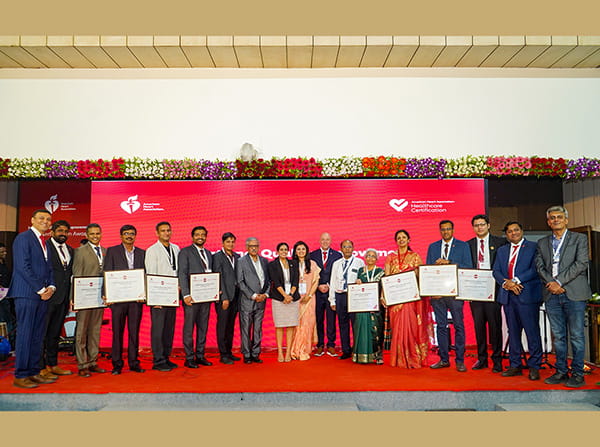 Numerous awardees standing on stage at the International Quality Improvement Certification Awards 2025