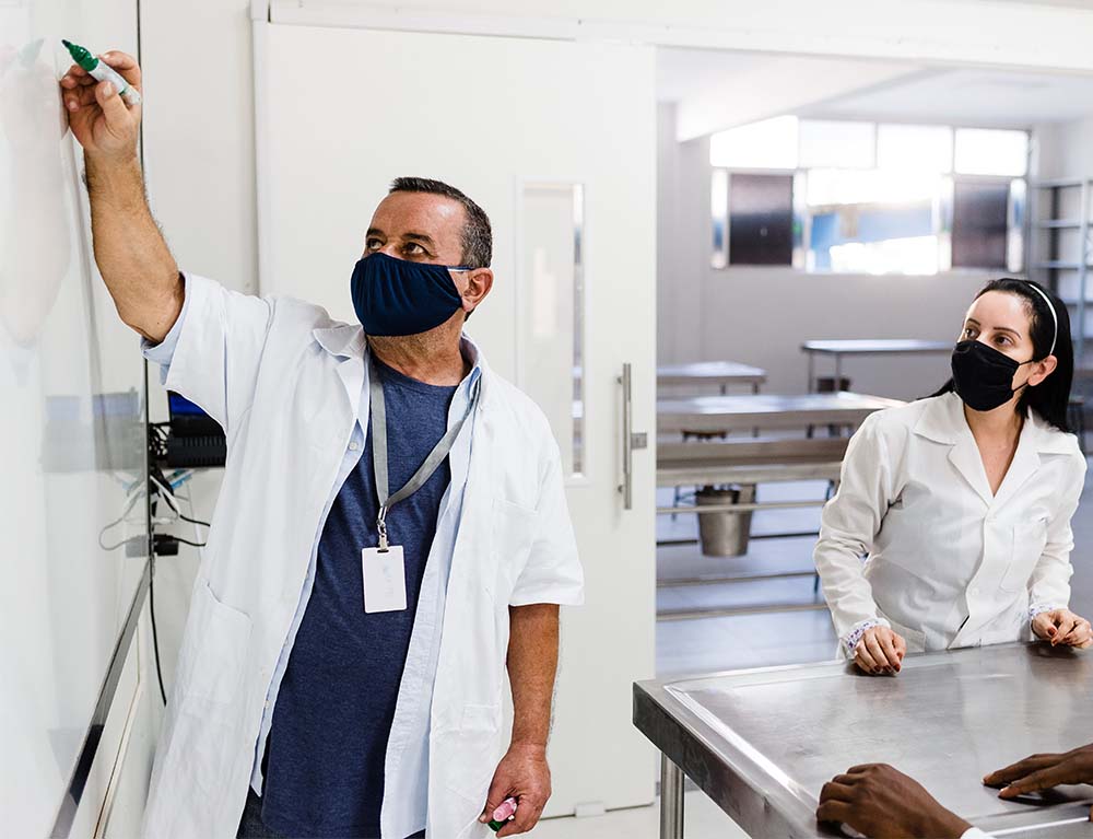 Teacher working with students