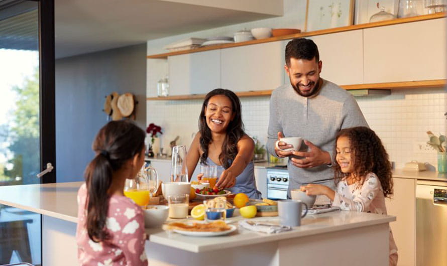 family eating breakfast together in the kitchen