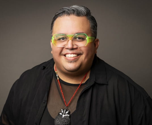 Professional headshot of Adrian Espinosa