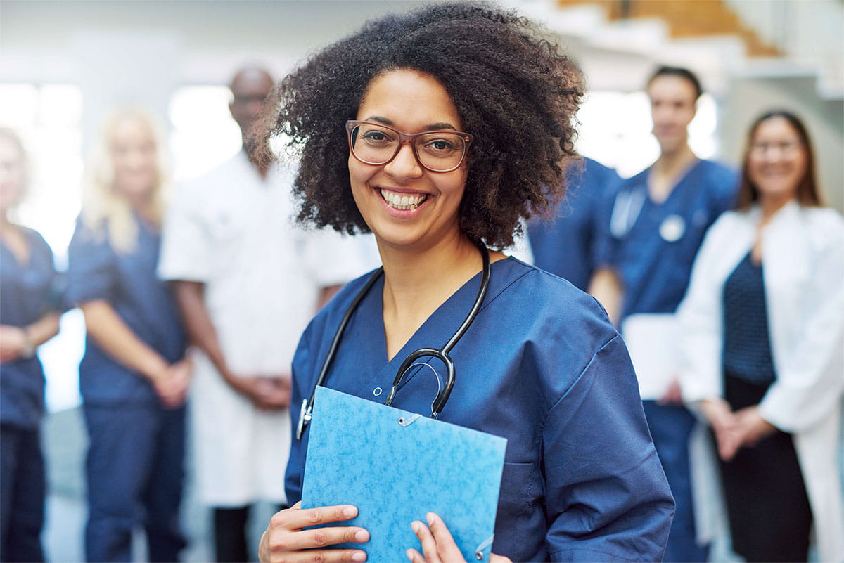 Medical worker smiles facing camera