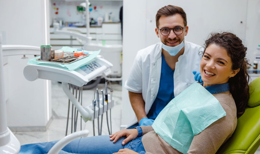 Dentist with patient during exam