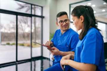 Two health care professionals in discussion