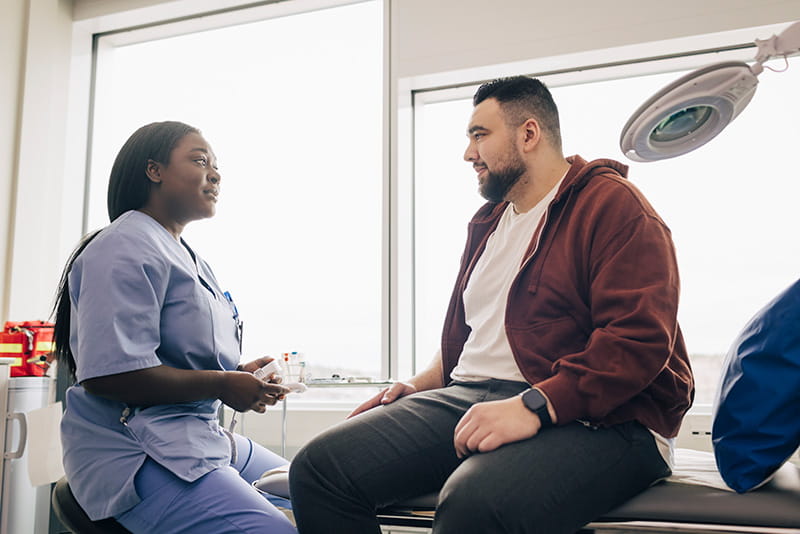 a patient at an appointment talking with a healthcare professional